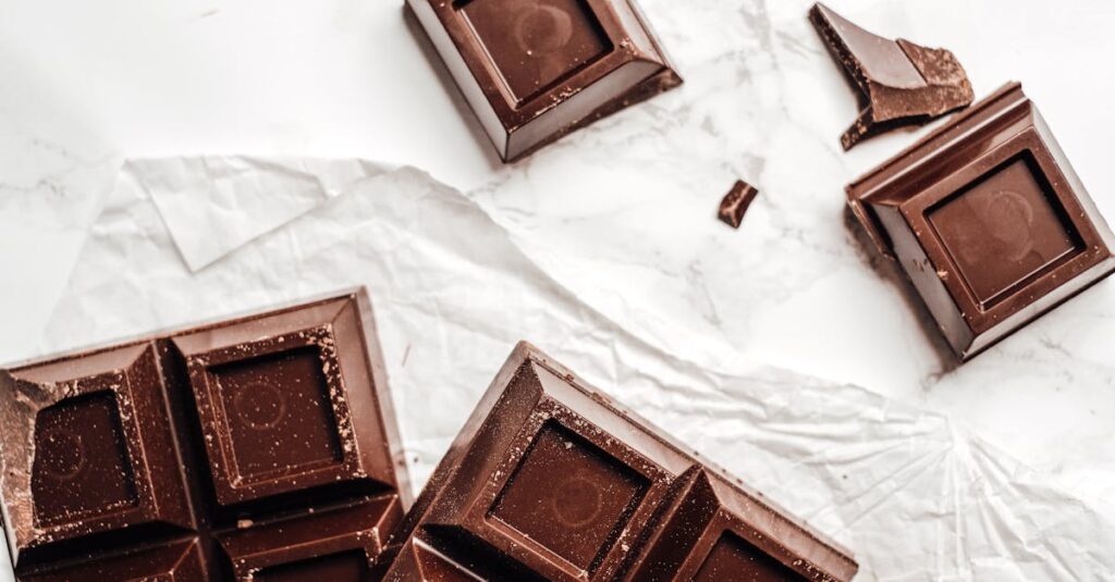 Delicious dark chocolate bars on a marble surface, captured in food photography style.